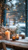 Cozy cafe with candles on a wooden table. Snow is falling outside the window and lights are shining around. Christmas Winter Evening Vertical picture stories photo
