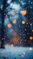 Beautiful abstract Christmas Winter Backdrop. Snow is falling and warm orange lights are shining. For a greeting card, invitation with place for text Vertical picture stories photo