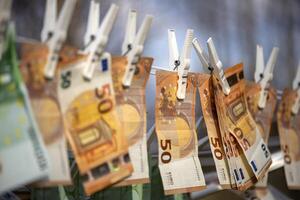 Washed Euro paper bills. Drying euro on a string.Money laundering photo