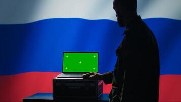 Russian ex KGB FSB service using radar on green screen laptop to detect missiles attacking borders. Moscow regime army using mockup device to scan approaching rockets, deploying shields, camera A photo