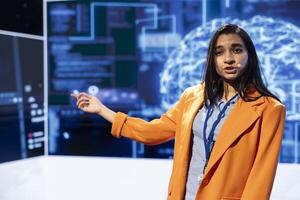 Speaker talking on stage in event bringing together leading specialists, researchers, innovators and companies from around the globe to explore latest developments in AI and machine learning photo
