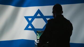 Israeli air defense command operator conscript using radar system on laptop to detect incoming ballistic missiles. IDF army soldier scanning rockets approaching borders, deploying shields, camera B photo