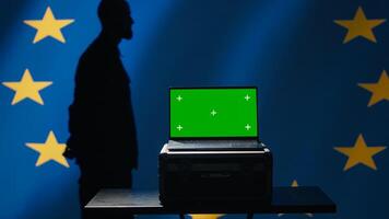 European Union using radar system on green screen laptop to detect missiles attacking member states. EU alliance army soldier scanning rockets approaching countries using mockup notebook, camera A photo