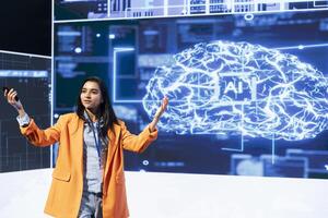 Woman speaking at tech summit, exploring latest AI technology trends and case studies. IT technician presenting latest artificial intelligence innovations during large event photo