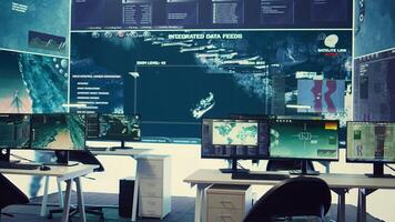 Empty military control room headquarters with a big display used to monitor global surveillance system with a world map. Army intelligence equipment and satellite radar footage, operation room. photo