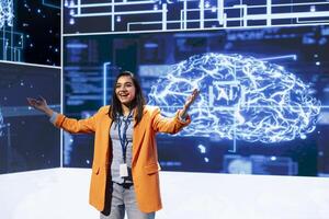 Joyous speaker doing presentation at tech conference, explore ways emerging AI technologies can positively enhance companies workforce. Cheerful presenter promoting artificial intelligence solutions photo