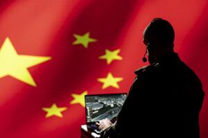 Chinese soldier using radar detecting ballistic missile attacks and conducting general space surveillance and satellite tracking. CCP agent using military laptop software preventing rockets photo