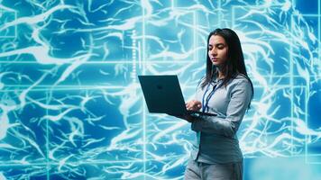 Software developer solving tasks on laptop, running artificial intelligence programming scripts. Woman using notebook to write lines of code for AI applications development, camera A photo