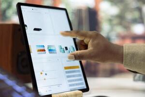 Young manager examining enterprise activity progress on achieving expansion goals, working from his home office. Businessman improving the workflow, accounting analytics plan. Close up. photo