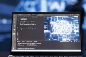Technician analyzing complex AI brain models on laptop. Extreme close up shot of IT expert using machine learning on notebook device to develop artificial intelligence technology photo