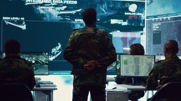 Military unit leader conducts reconnaissance operation to gather data and support troops in the field. Uses command center gear to provide crucial information, federal satellite radar. Camera A. photo
