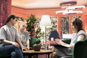 Family therapy session explores the emotional and mental health of a teenager, with the psychologist helping her and her mother address intrusive thoughts and behavioral problems. photo