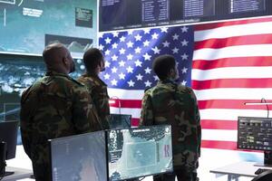 American military officers in cyber command center protect state secrets, manage classified information and engage in high tech digital warfare strategies to ensure cybersecurity and data protection. photo