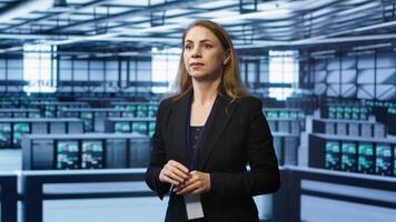 System administrator in high tech data center looking at hologram visualization. Computer scientist working on securing server terminals using AR tech, preventing hacker attacks, camera A photo