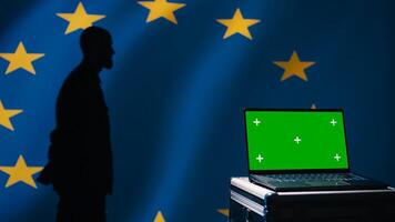 European Union using radar system on green screen laptop to detect missiles attacking member states. EU alliance army soldier scanning rockets approaching countries using mockup notebook, camera B photo