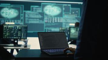 Governmental hackers at work monitoring cyber threats in high tech agency, implementing cybersecurity measures. IT expert focuses the importance of online privacy and malware protection. Camera B. photo