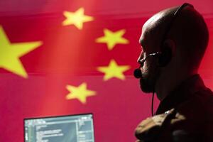 Military dispatcher in command center ready to respond to emergencies and communicate with troops on front lines. War telecommunications operator in uniform talking in headset mic, close up photo