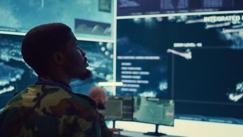 Military unit leader conducts reconnaissance operation to gather data and support troops in the field. Uses command center gear to provide crucial information, federal satellite radar. Camera B. photo
