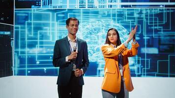 Tech startup managers offer latest AI services during tech summit. Businesspeople using mic to do presentation for business investors interested in artificial intelligence, camera B photo