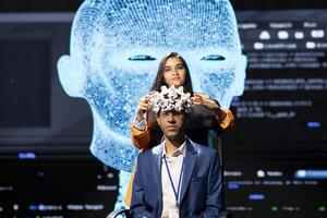 Portrait of neuroscientist doing demonstration at AI convention gathering tech startups and academics, showing how to use EEG headset to link brain with artificial intelligence photo