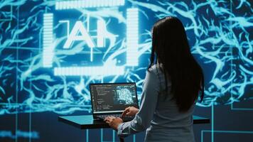 AI specialist reviews data charts, emphasizing importance of data driven decision making in tech industry. Engineer developing innovative artificial intelligence solutions for startup, camera A photo