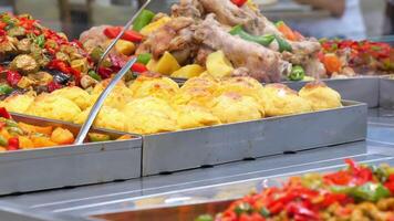 A Delightful and Delicious Variety of Food Dishes Clearly on Display at a Buffet Over Here video