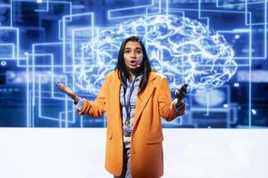 Engineer using mic during presentation, exploring ways emerging AI technologies can enhance businesses workforce. Data researcher at event presents strategies for using artificial intelligence photo