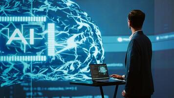 System administrator uses neural networks modeled after human brain to solve complex problems. AI researcher in futuristic workspace using artificial intelligence to look at data, camera A photo