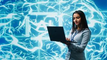 Technician using laptop to maintenance artificial intelligence neural networks made up of interconnected nodes layers. Admin using AI system aiding in processing and transmitting information, camera A photo
