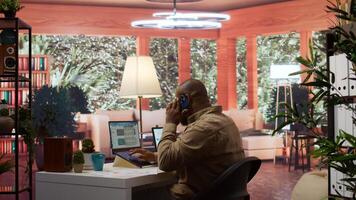 Entrepreneur reviewing statistics data on a laptop remotely from his house, makes a briefing report. Business owner studying sales numbers and the profit to increase organizational funds. Camera B. photo