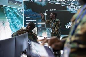 Army intelligence specialists use high tech computer systems and satellite data to enhance national security, process and communicate important information. Helping troops with a field mission. photo