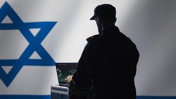 Israel Air Defense Forces early warning systems operator monitoring incoming enemy aerial attacks. IDF agent maintains air space superiority with radar during Middle East conflicts, camera A photo