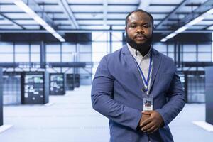 Engineer in server room implementing and maintaining security measures to protect data and systems from unauthorized access or cyber threats. Data center employee doing hardware installation photo
