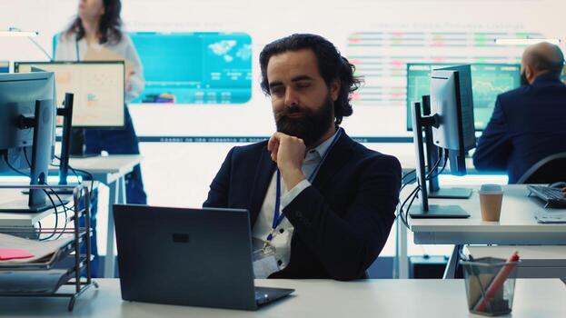 Project manager examining key performance metrics to ensure global business success, working with annual infographics to understand what needs improving. Multinational company activities. Camera A. photo