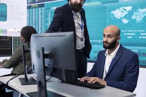 Project manager ensuring productivity and efficiency in creating annual reports, providing guidance for her staff in order to impress the shareholders. Strategic business objectives. photo