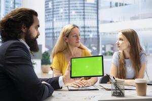 People receiving personalized financial plan from financial advisor using isolated screen tablet. Customers learn how to make profitable decisions from agent using chroma key device photo