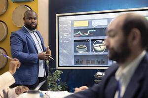 Business group collaborating on developing corporate culture initiatives, discussing values alignment and cultural integration efforts to strengthen organization, increase performance. photo