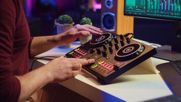 Sound engineer mixing and mastering sounds with electronic audio console, pressing controls and pre amp knobs. Music producer improving sound quality, synchronize soundtracks. Camera A. photo