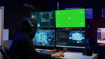 Cybercriminal using AI machine learning and isolated screen PC to develop system exploits. Hacker using artificial intelligence tech and mockup monitor to build script tricking firewalls, camera B photo