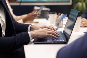 Business partners working together on a project in a conference room, reviewing performance metrics and success indicators to measure progress. Employees accomplishing company goals. photo