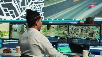 Team of employees monitoring delivery trucks with gps coordinates on satellite navigation, tracking orders with awb shipping system. Operators working in control center. Camera A. photo