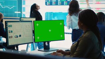 Business analyst examining monthly results and performance metrics online, isolated screen in multinational company headquarters. Consultant reviews income and expenditure budget. Camera A. photo