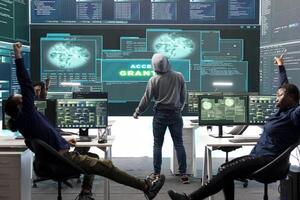 Pleased proud hackers team jumping around after gaining access into rival government database, feeling happy about their success. Professional IT experts hacking network systems. photo