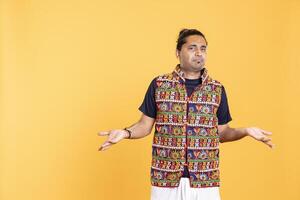 Man shrugging shoulders, unable to provide answer, having detached apathy facial expression. Apathetic person doing hand gesturing showing lack of knowledge, studio background photo