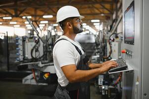 PVC industry worker or operator making frames for windows and doors photo