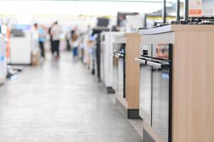 rows of gas stoves selling in home appliance store photo