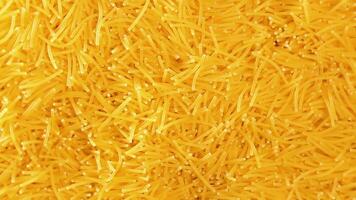 Background of Uncooked Noodles that Slowly Rotating Clockwise - Top View, Close-Up. Texture of Dry Vermicelli Turning Around. Raw Pasta - Right Rotation video