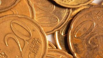 Scattered 20 Euro Cent Coins, Rotating Money Background - Top View, Macro. Euro Money Currency. A Lot of Twenty Cent Cash. Business, Finances and Money Saving Concept - Slow Rotation Left video