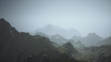 A misty mountain range engulfed in fog video