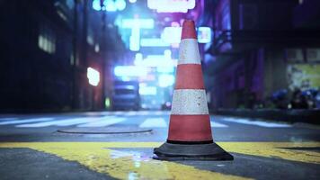 A traffic cone sitting on the side of a road video